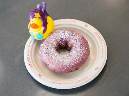 The blueberry icing and powdered sugar on top of a vanilla-cake doughnut makes this Duck...