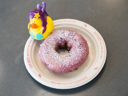 The blueberry icing and powdered sugar on top of a vanilla-cake doughnut makes this Duck...