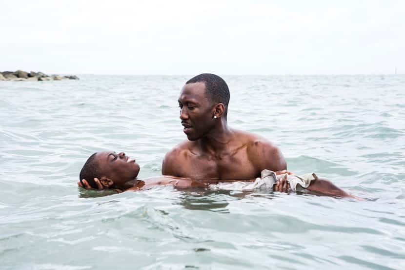 This image released by A24 shows Alex Hibbert, foreground, Oscar favorite Mahershala Ali,...