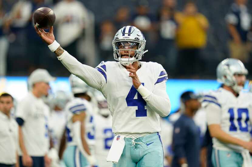 Dallas Cowboys quarterback Dak Prescott (4) warms up before an NFL football game against the...
