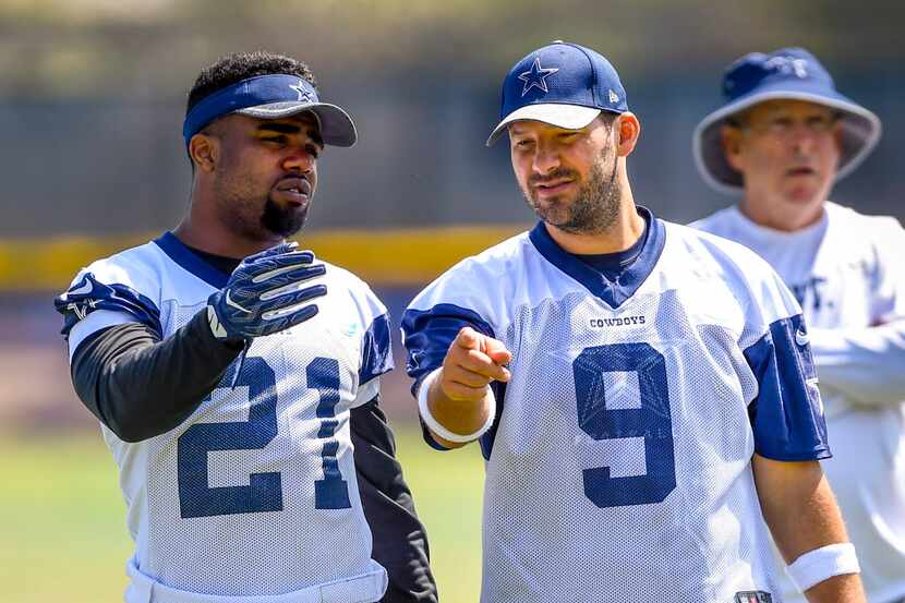 Dallas Cowboys running back Ezekiel Elliott (21) and teammate quarterback Tony Romo (9) talk...
