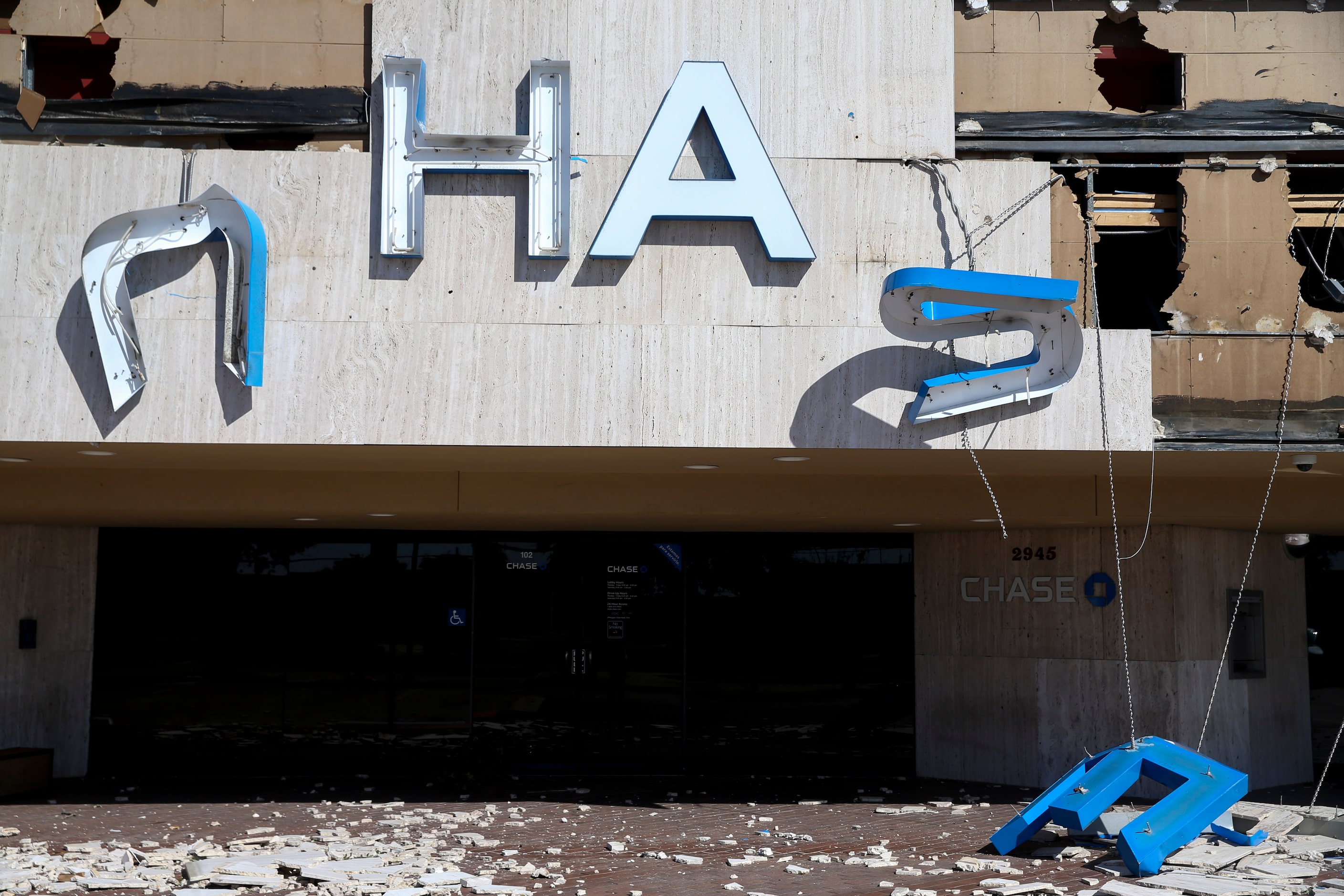 A sign on a Chase Bank on Walnut Hill Lane sits on the ground on Monday, October 21, 2019 in...