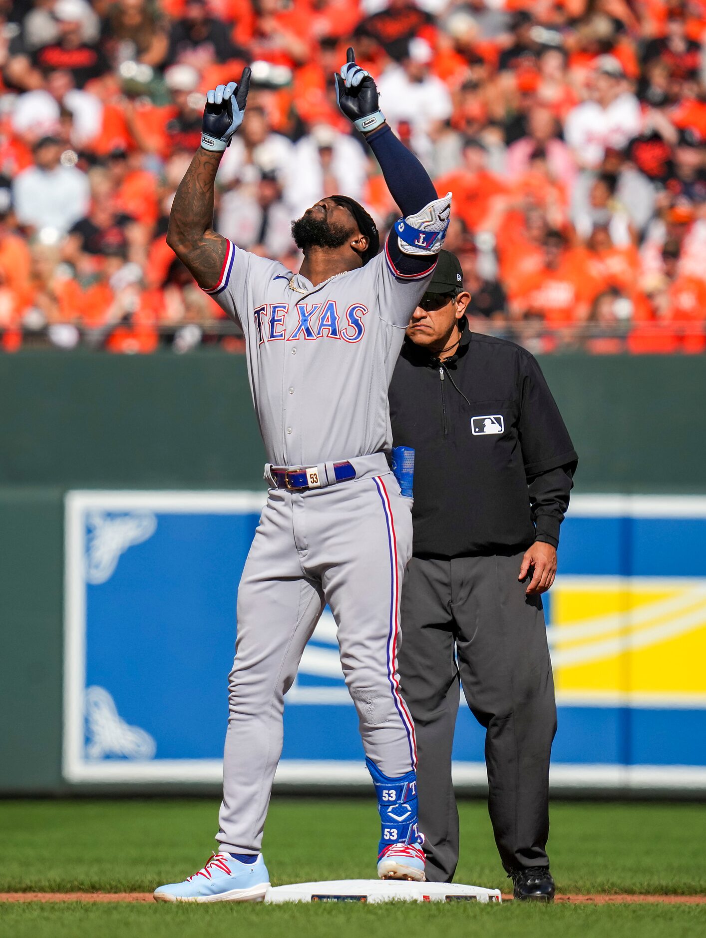 Texas Rangers right fielder Adolis Garcia celebrates after reach second base with a double...