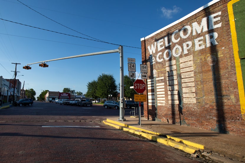 A sign welcomes visitors to the downtown square of Cooper, Texas, on July 11, 2019.