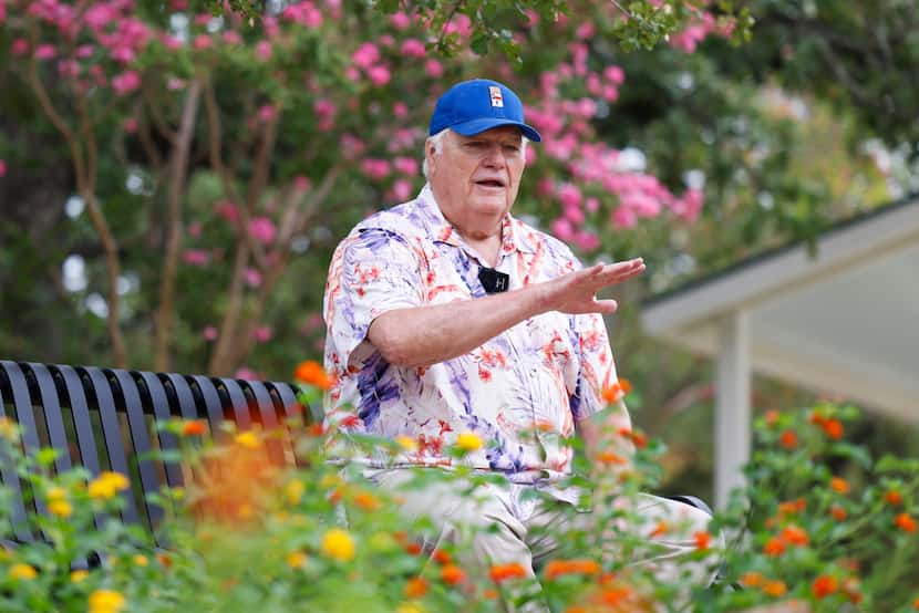Sports commentator Dale Hansen reminisces while sitting on a bench at a walking trail on the...