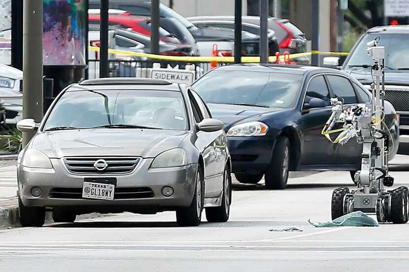 A law enforcement robot ripped the window out of the vehicle the shooter arrived in after...