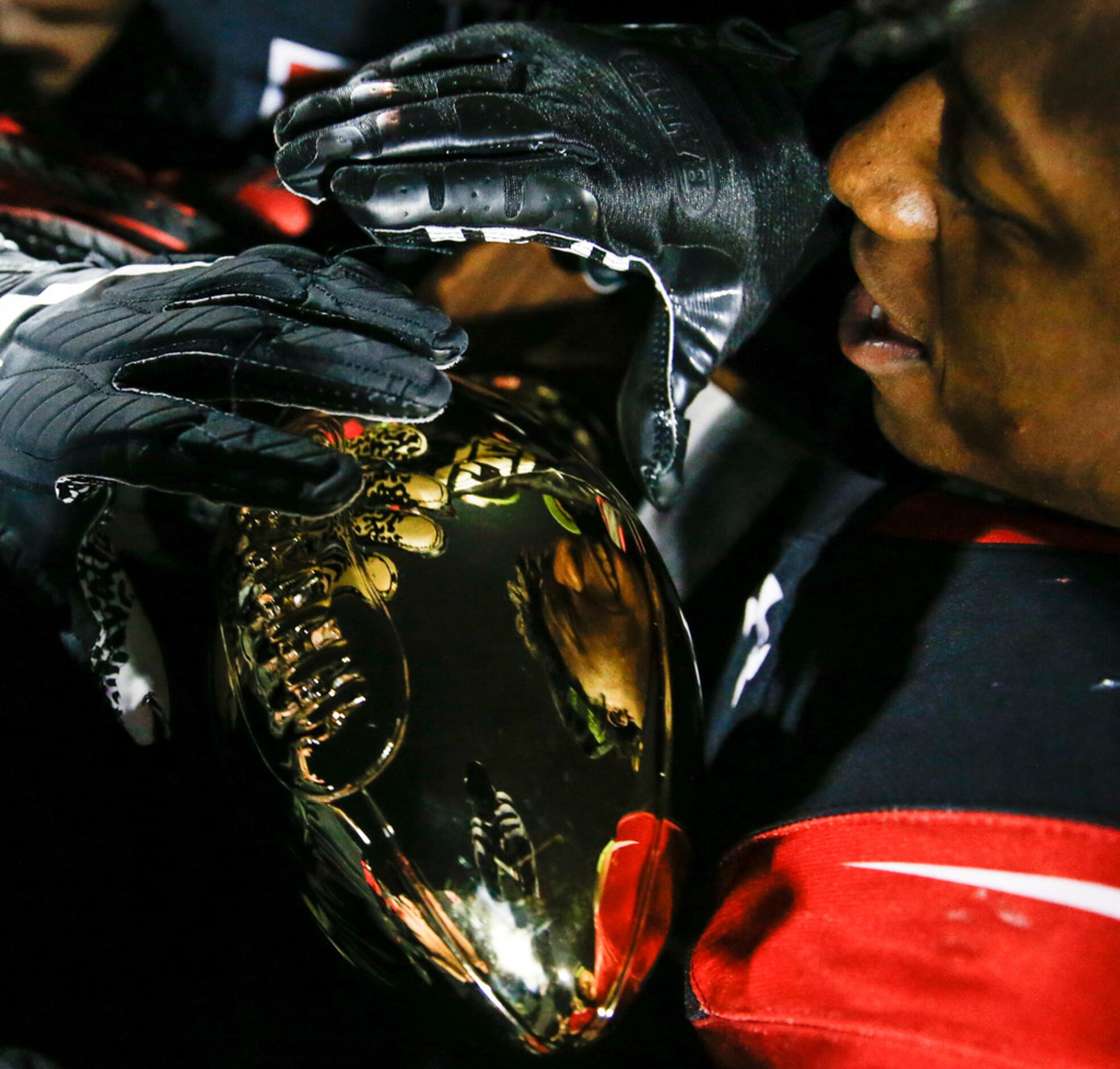 The Cedar Hill Longhorns celebrate their 7-6A district championship win over the DeSoto...