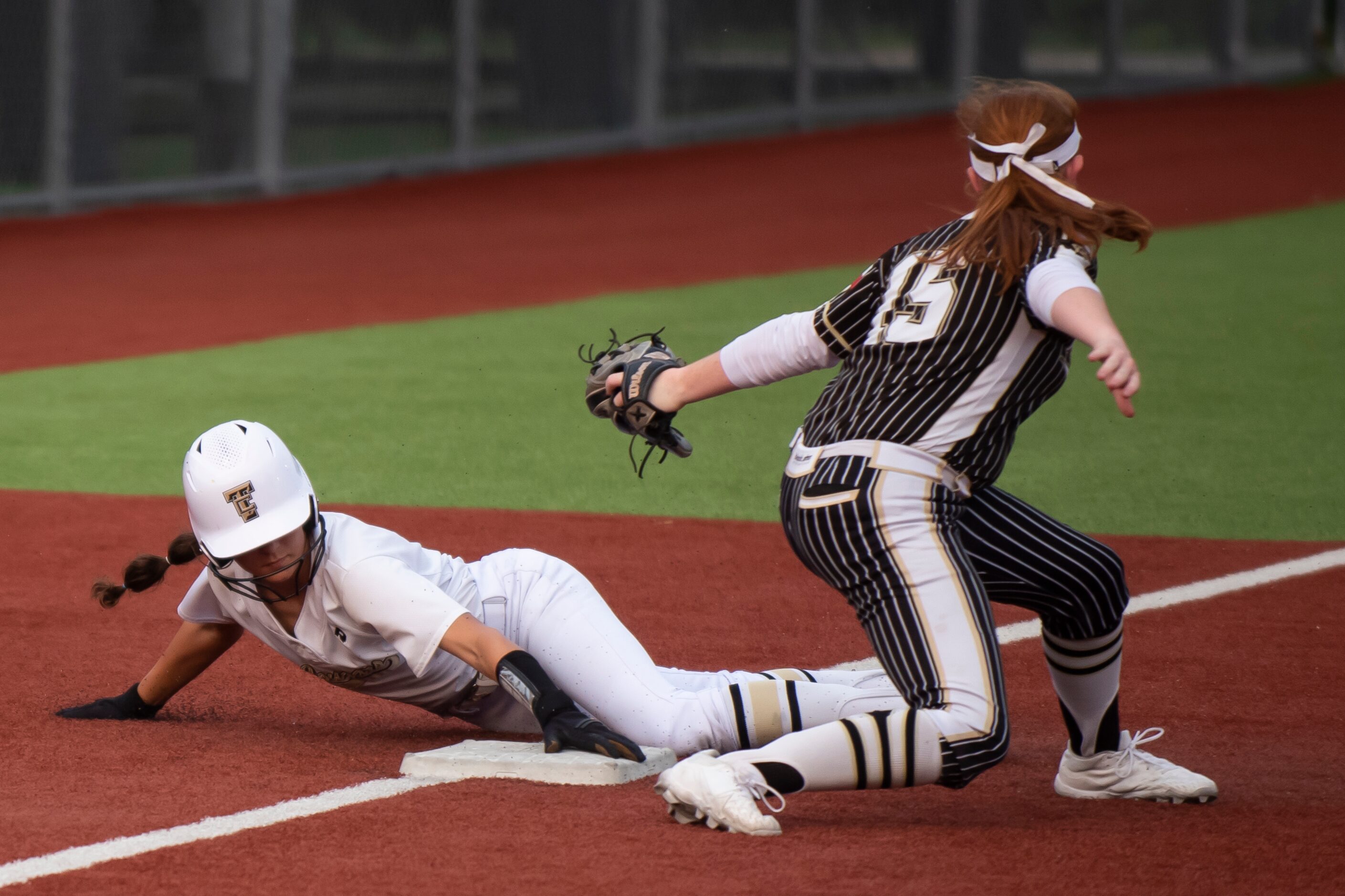 The Colony’s Sabrina Wick (7) steals third base and avoids the tag by Royse City’s Ryley...