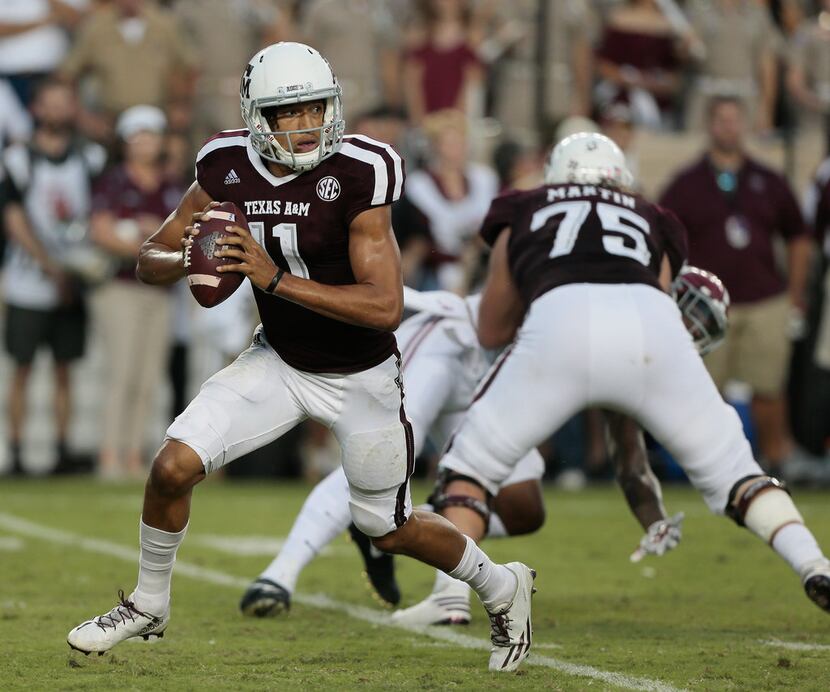 COLLEGE STATION, TX - OCTOBER 07:  Kellen Mond #11 of the Texas A&M Aggies scrambles out of...