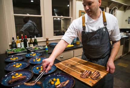 Chef Casey La Rue plates duck with squash at an Airbnb in Dallas.
