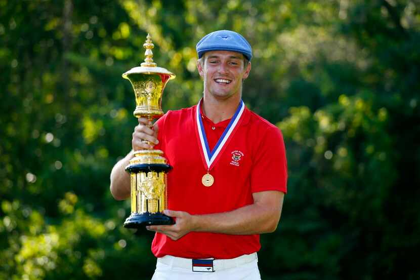 OLYMPIA FIELDS, IL - AUGUST 23:Bryson DeChambeau holds the Theodore A. Havemeyer trophy...