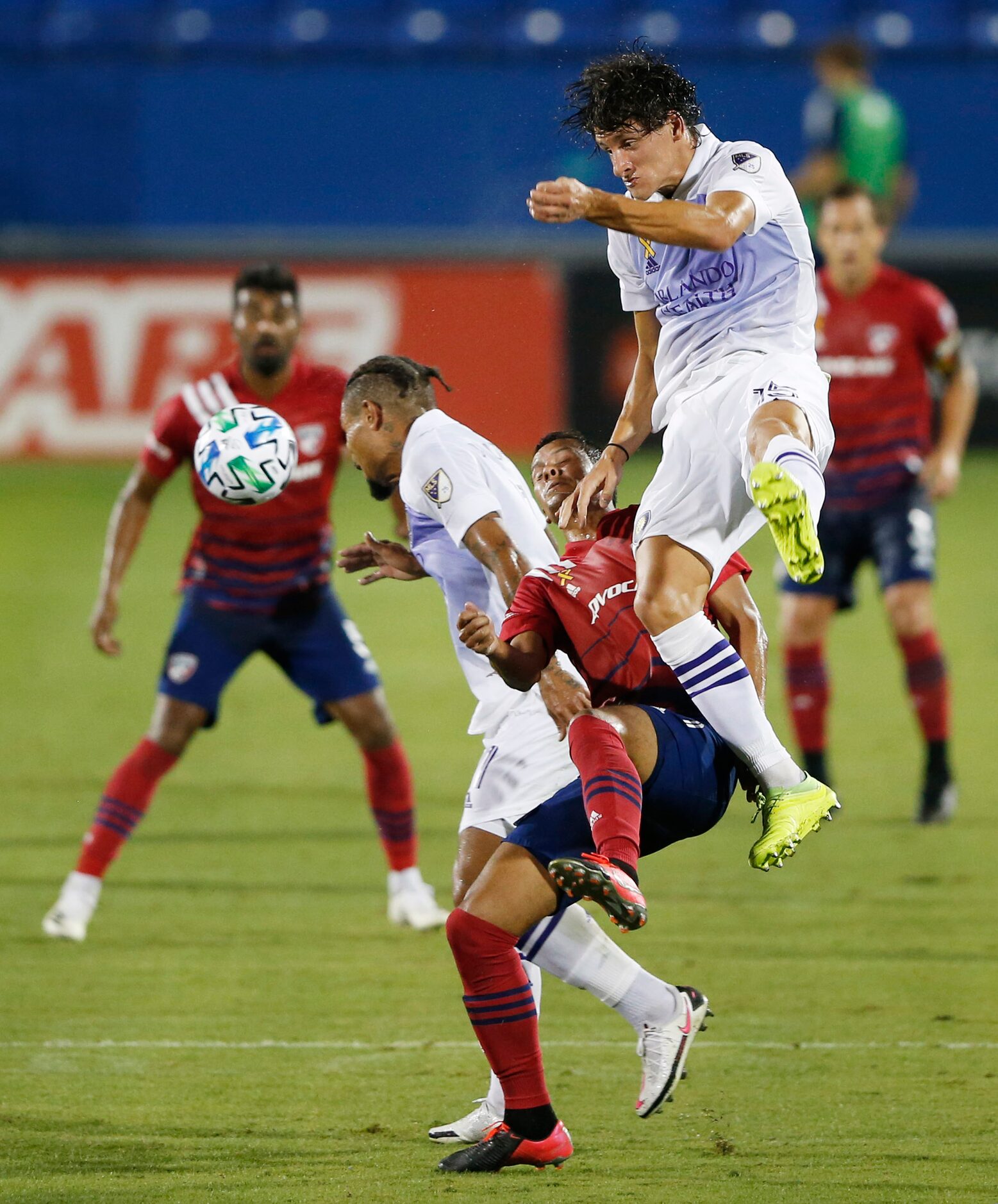 Orlando City defender Rodrigo Schlegel (15) and FC Dallas Pablo Aránguiz (10) collide during...