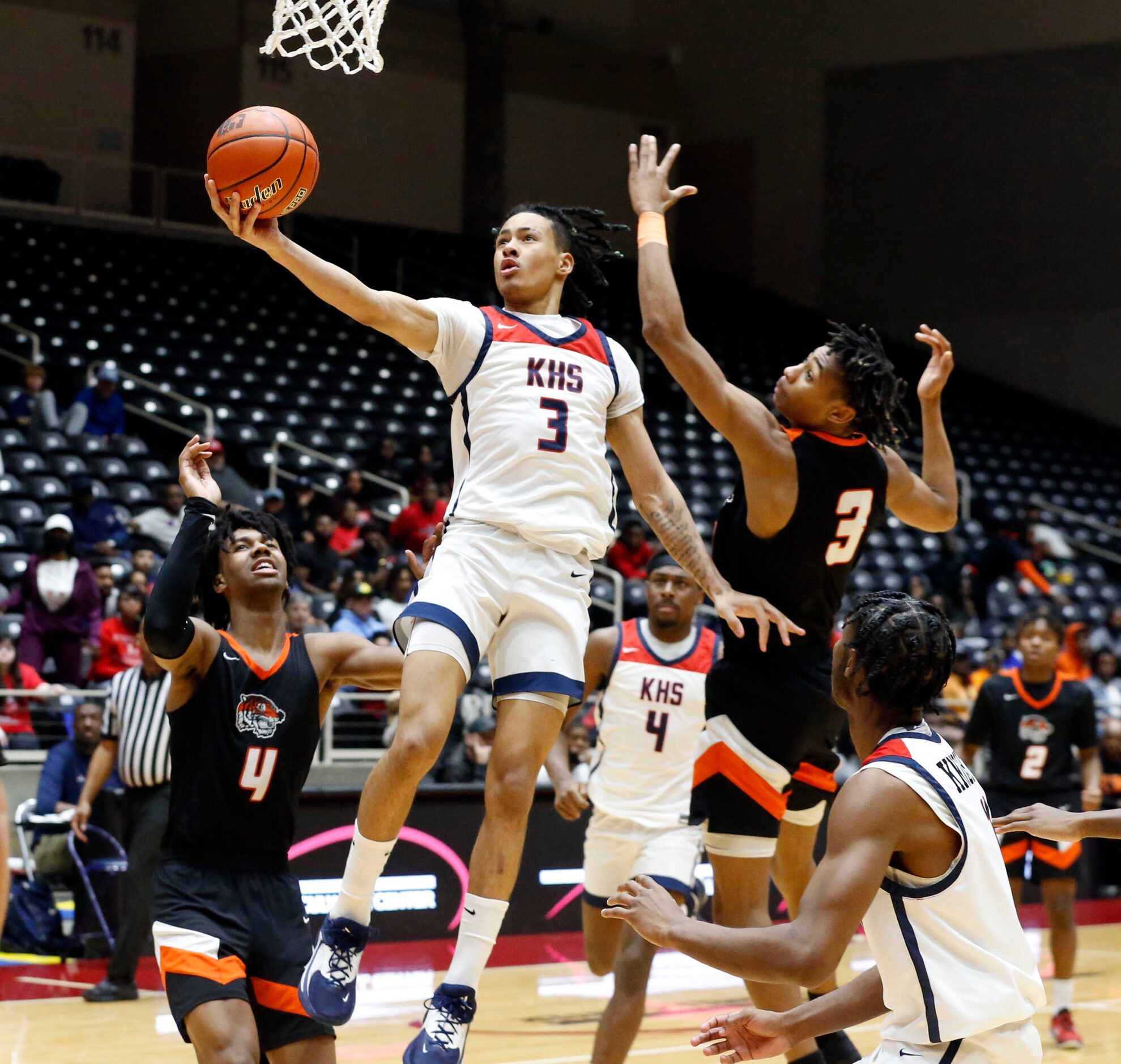 Kimball High’s Tylar Hankamer (3) takes a layup shot during the Class 5A State Boy’s...