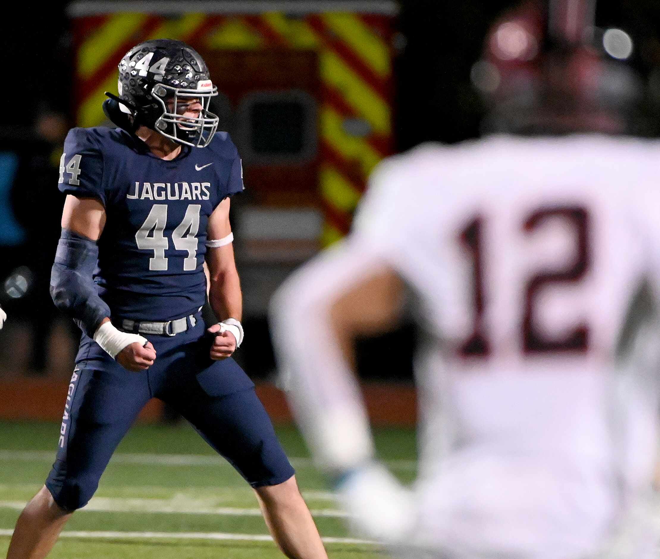 Flower Mound's Ryan Brubaker (44) celebrates after a stop in the first half of a high school...