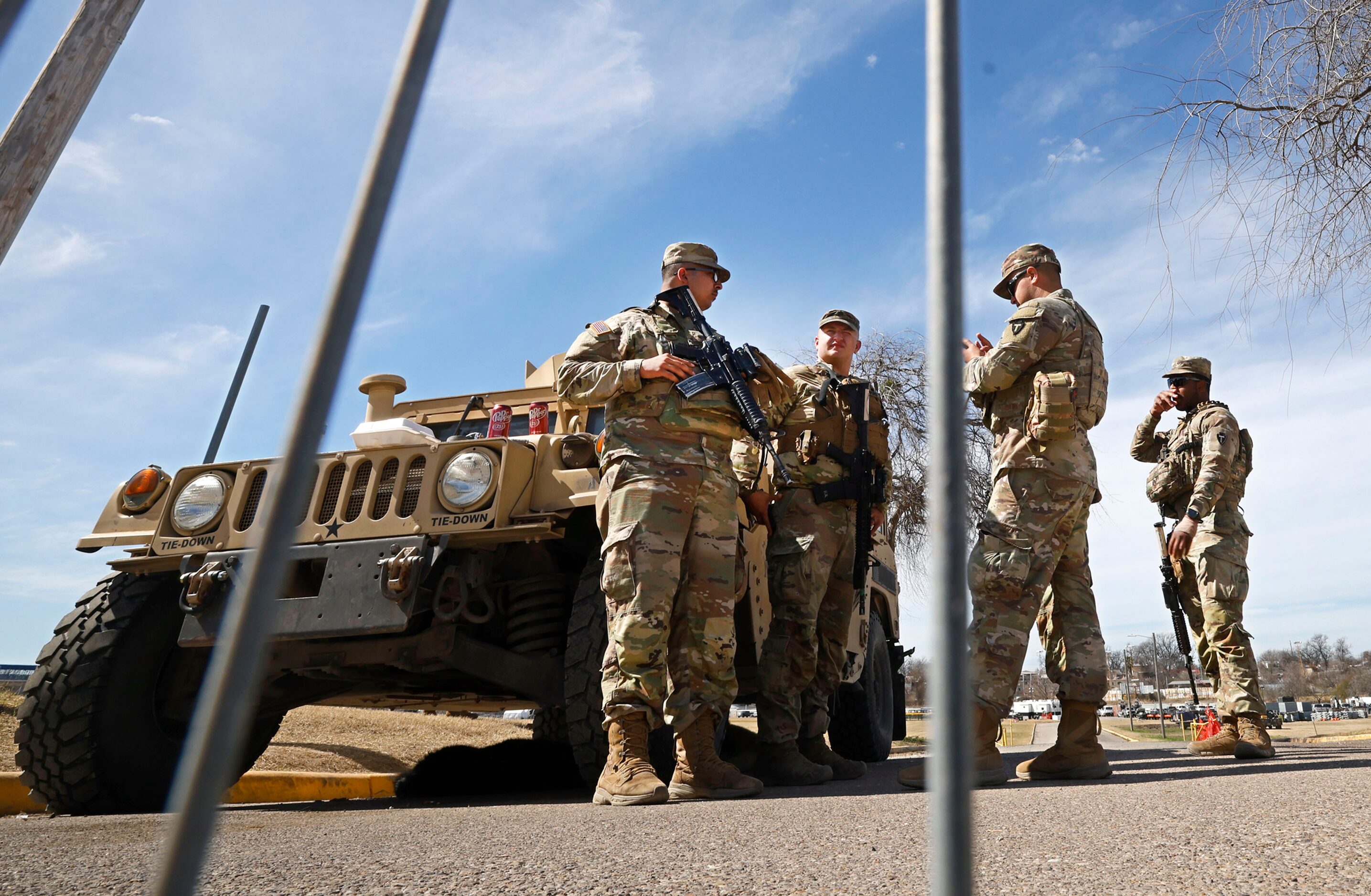 Texas National Guard soldiers stand by the gate at Shelby Park Tuesday, Jan. 30, 2024, in...