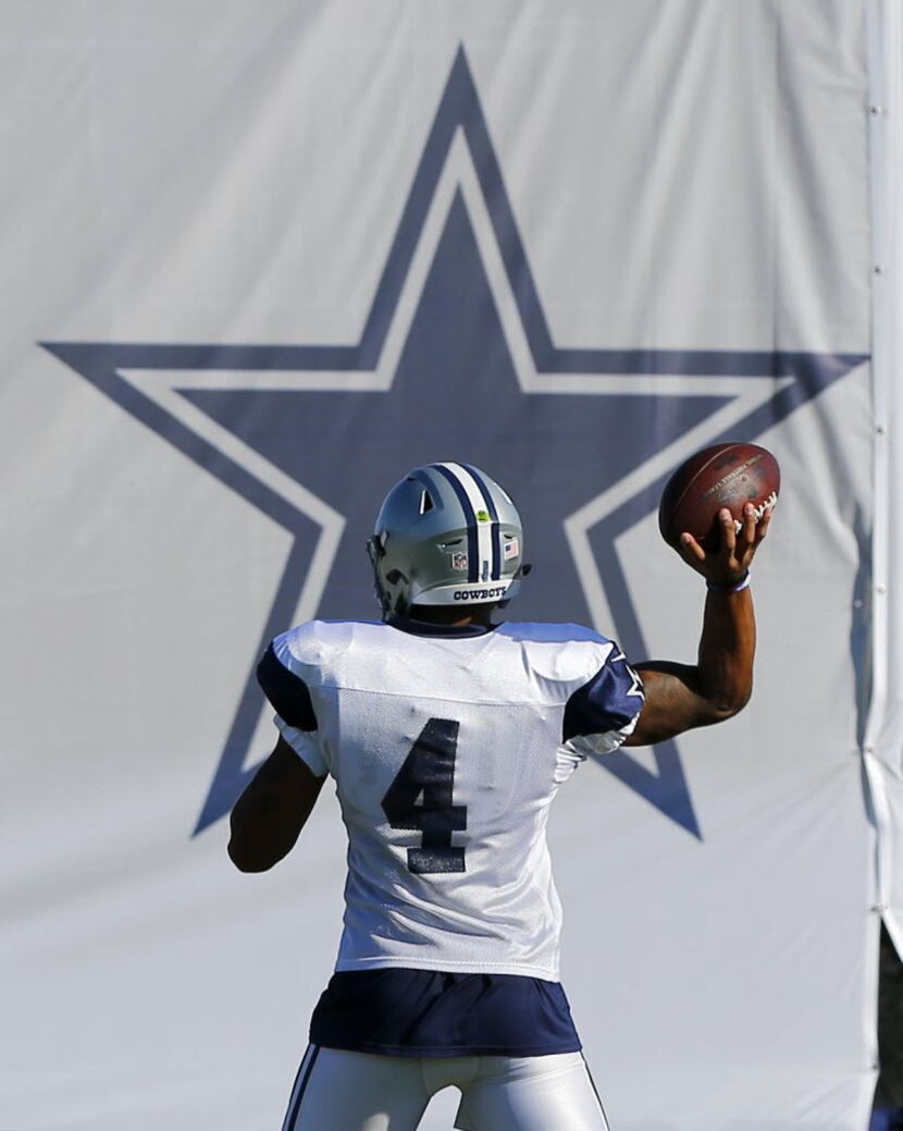 Dallas Cowboys quarterback Dak Prescott (4) throws a pass before the large tower star during...