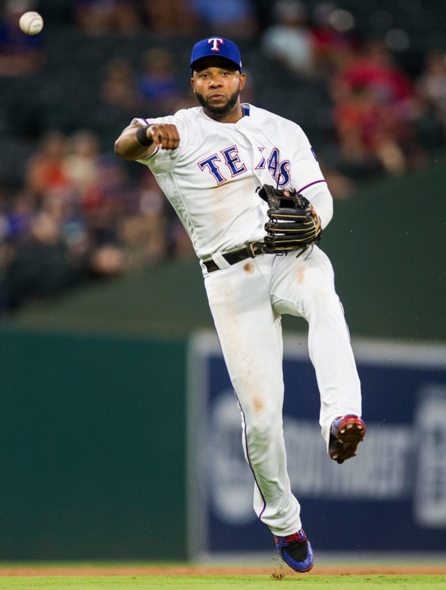 Texas Rangers shortstop Elvis Andrus (1) throws to first to out Oakland Athletics right...