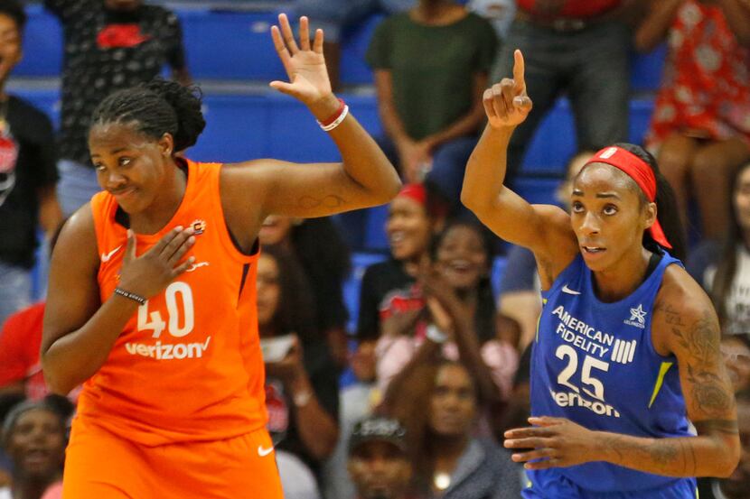 Dallas Wings forward Glory Johnson (25) gestures after making a shot in the first quarter...