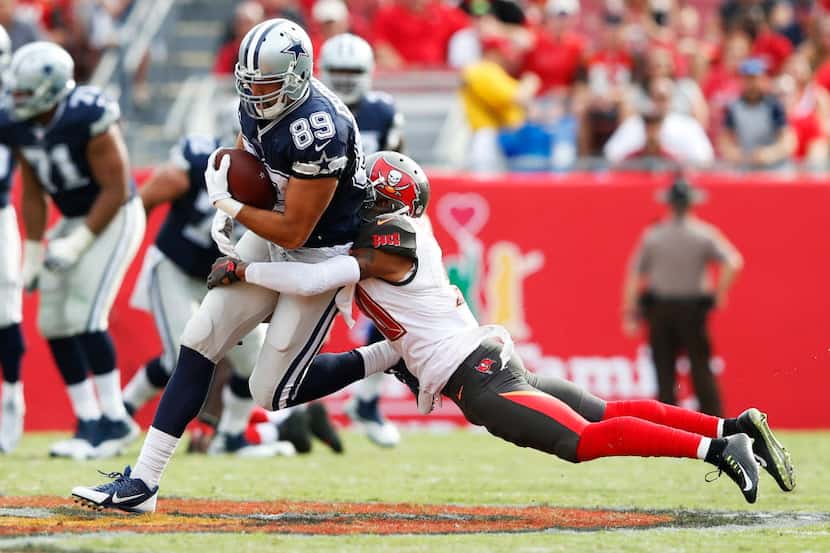 Dallas Cowboys tight end Gavin Escobar (89) is tackled by Tampa Bay Buccaneers free safety...