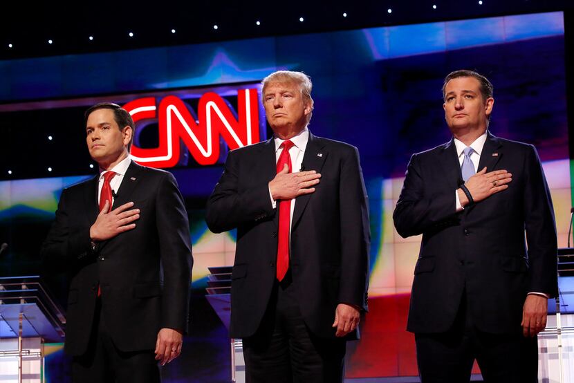 President Donald Trump, shown flanked by GOP primary election foes Marco Rubio (left) and...