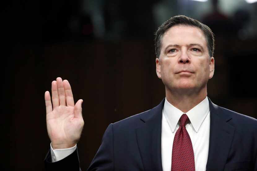 Former FBI Director James Comey is sworn in during a Senate Intelligence Committee hearing...