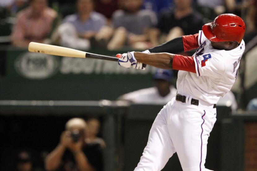 Texas Rangers second baseman Jurickson Profar (13) hits a walk off home run to win the game...