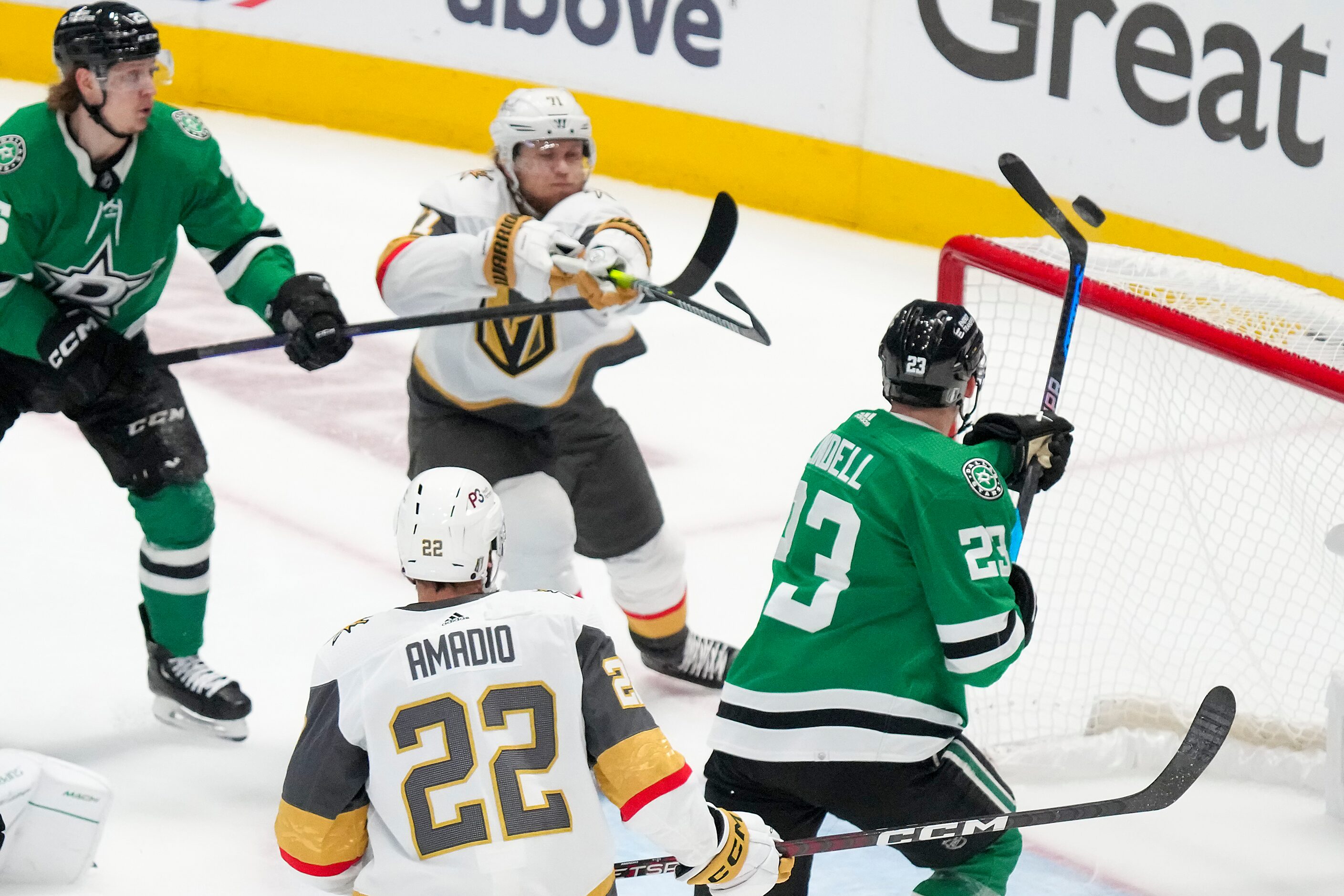 Dallas Stars defenseman Esa Lindell (23) knocks the puck away from the net, resulting in a...