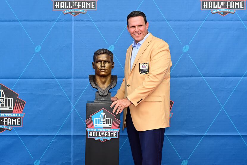 Former NFL player Tony Boselli poses with his bust during an induction ceremony at the Pro...