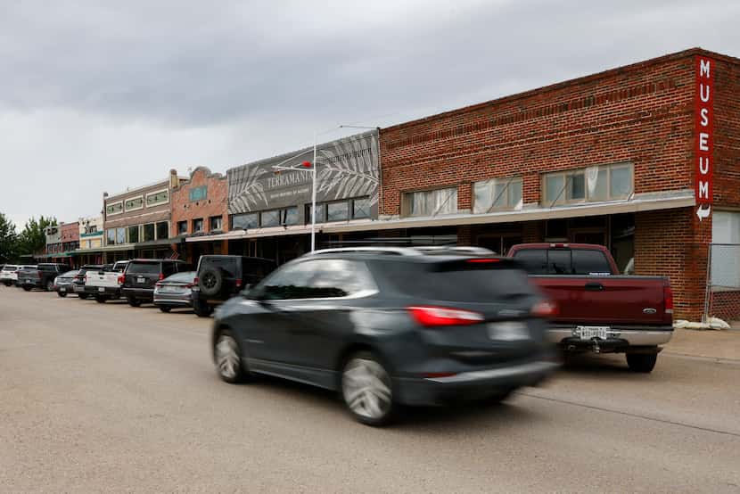 Cars drive along Pecan Street near the town square in Celina.