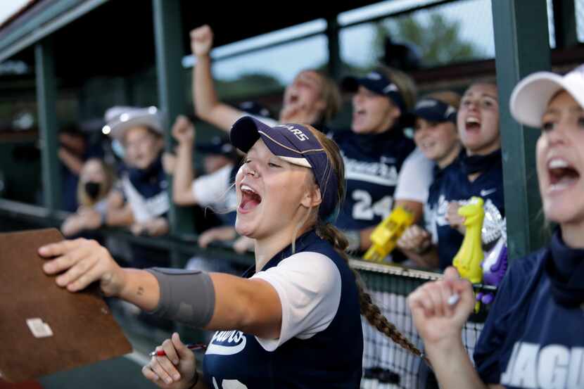 Flower Mound players cheer on their team during a 10-0 victory over Allen on Friday night in...