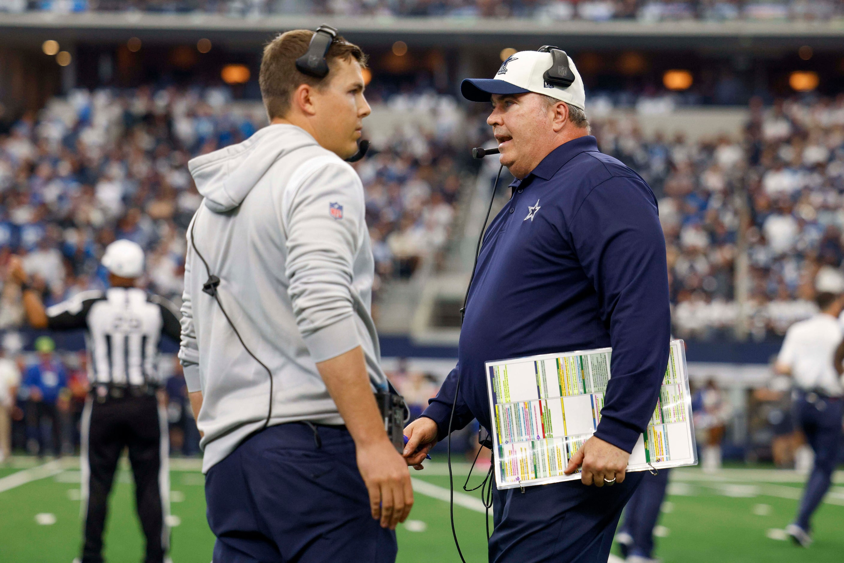 Dallas Cowboys head coach Mike McCarthy (right) talks with offensive coordinator Kellen...