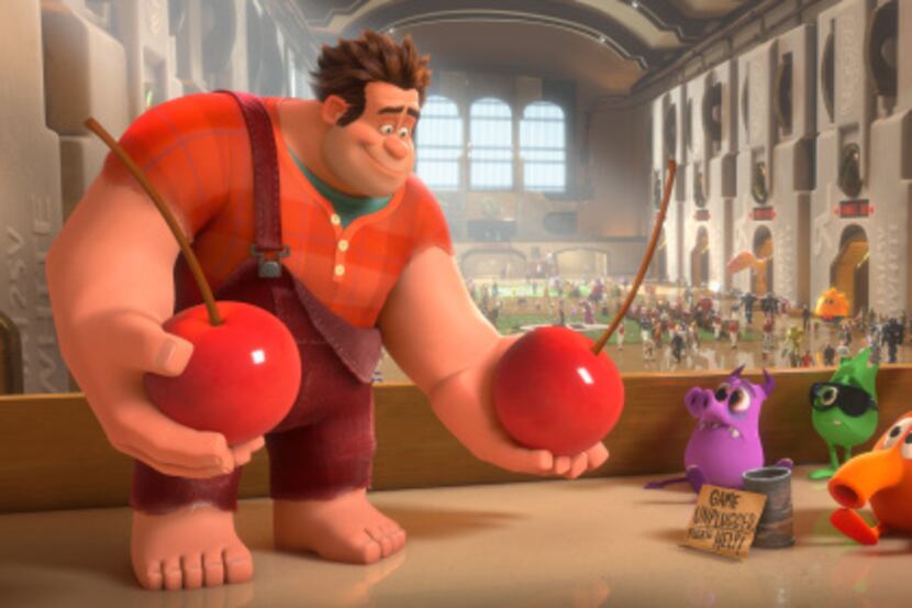 Ralph, left, voiced by John C. Reilly in a scene from "Wreck-It Ralph." The new Walt Disney...
