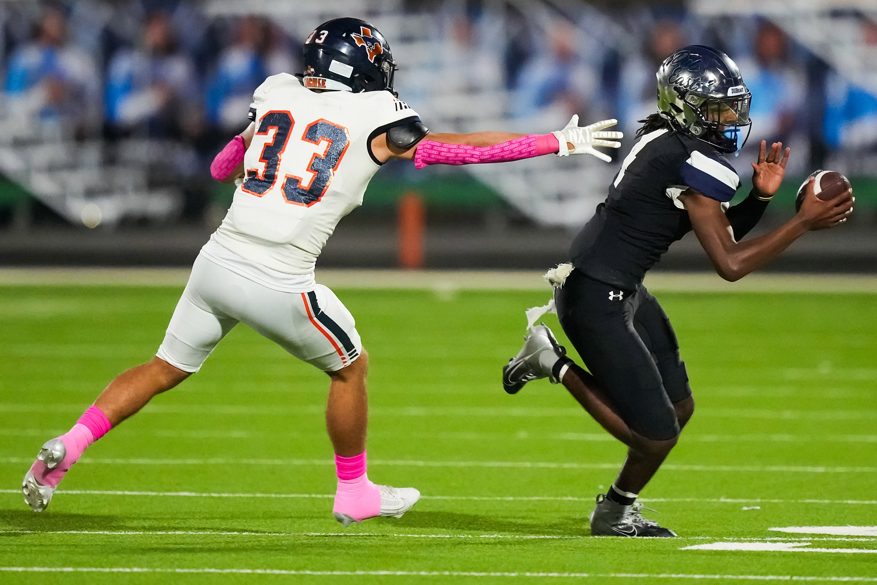 Wylie East quarterback Howard Fisher IV (4) gets past Sachse linebacker Trenton Honeycutt...