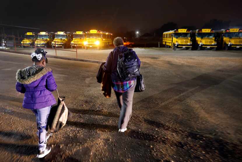 In the predawn hours, Terrell ISD bus driver Schrildea Glover and first grader Kensley...