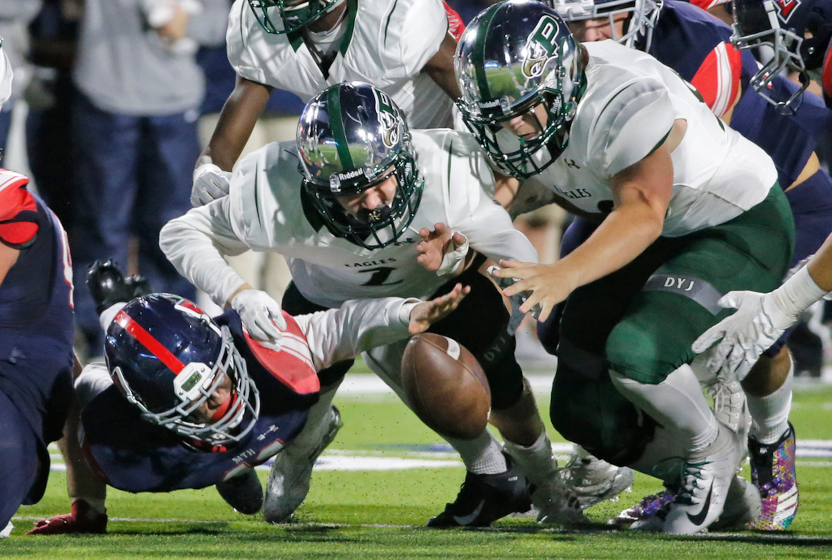 Boyd defender Ben Altizer, left, and Prosper's Derien Ivy, center, and Jackson Thetford (90)...