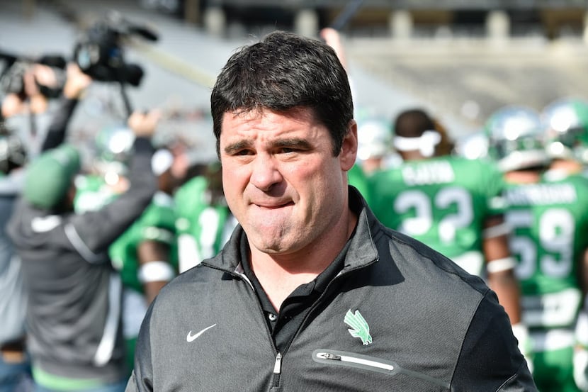 North Texas head coach Seth Littrell walks back to the locker room before they face...
