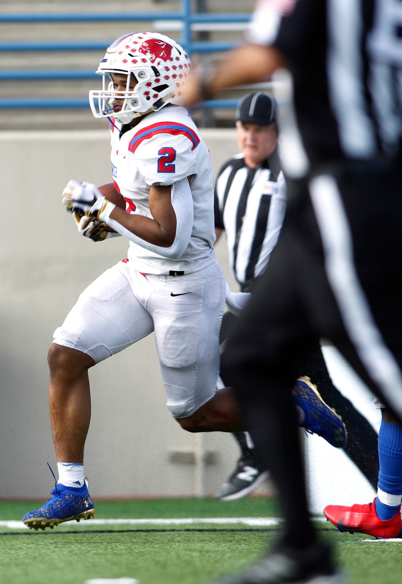 Parish Episcopal running back Andrew Paul (2) splits a pair of referees as he crosses the...