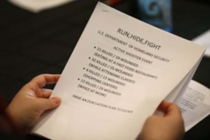  A participant looks through a handout at a training class taught by Dallas Police Officer...