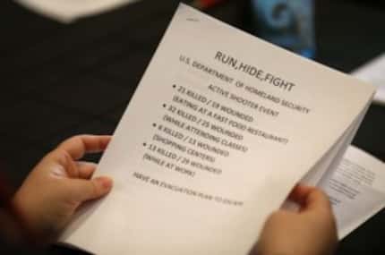  A participant looks through a handout at a training class taught by Dallas Police Officer...