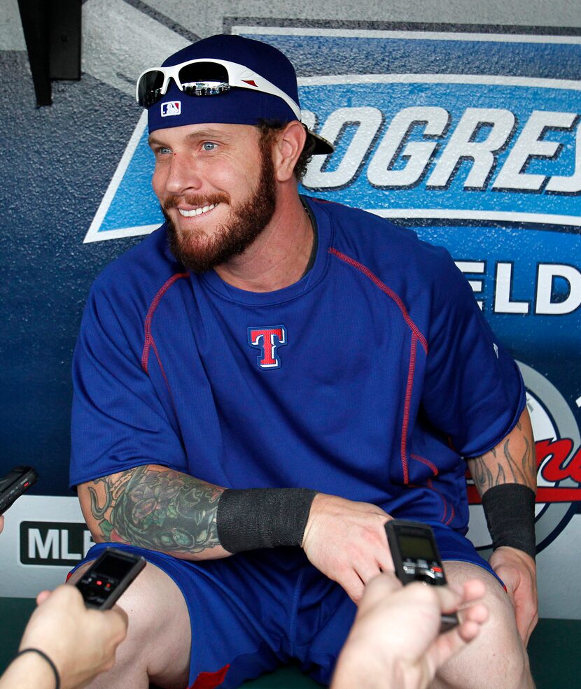 Texas Rangers' Josh Hamilton shares a laugh as he talks to the media prior to the Rangers...