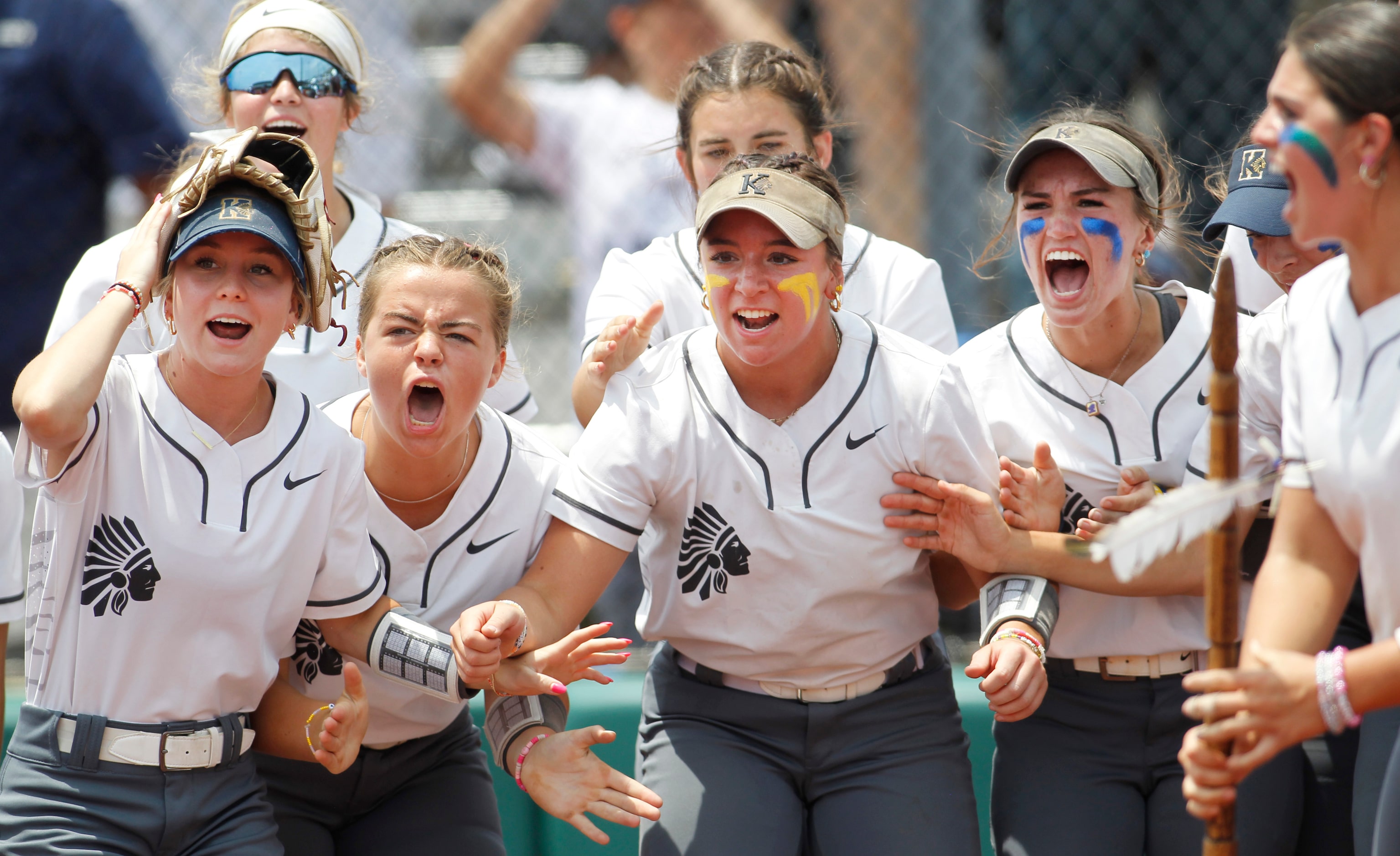 Keller players await the arrival at home plate after teammate Kaiya Fabela (14) hit a 2-run...