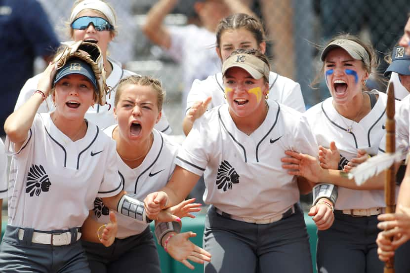 Keller players await the arrival at home plate after teammate Kaiya Fabela (14) hit a 2-run...