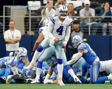 Dallas Cowboys quarterback Dak Prescott (4) celebrates a touchdown by running back Ezekiel...