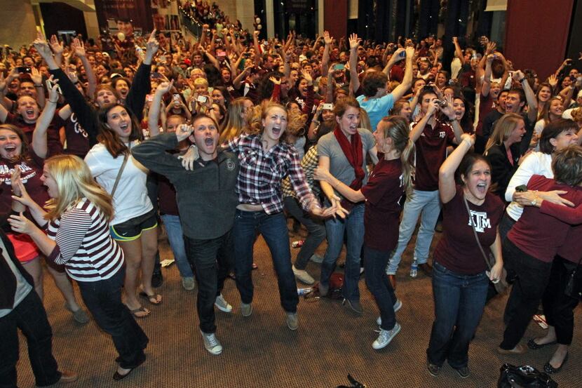 Aggies fans celebrate after the announcement of Texas A&M quarterback Johnny Manziel winning...