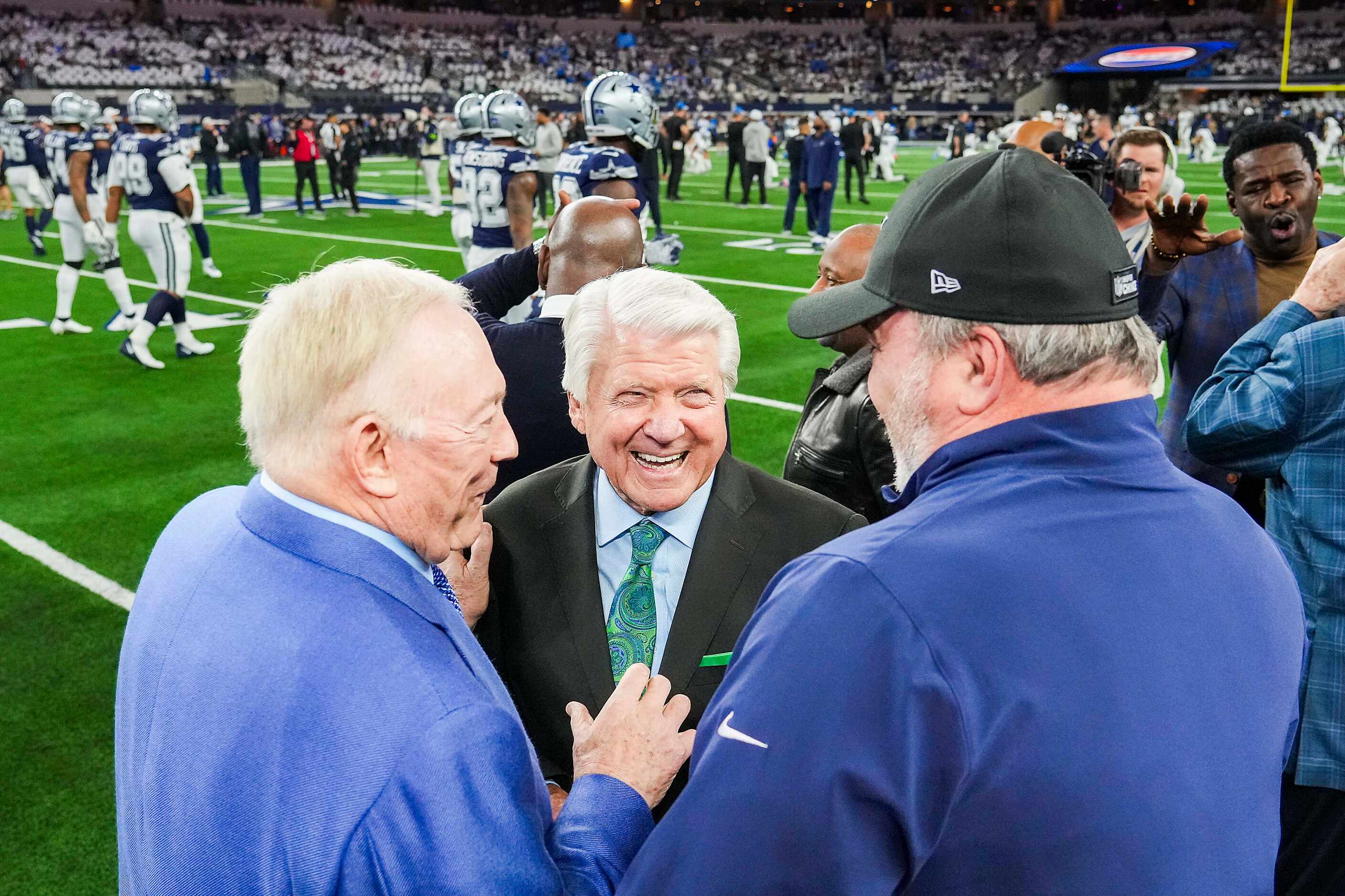 Former Dallas Cowboys coach Jimmy Johnson (facing) laughs with Cowboys owner  Jerry Jones...