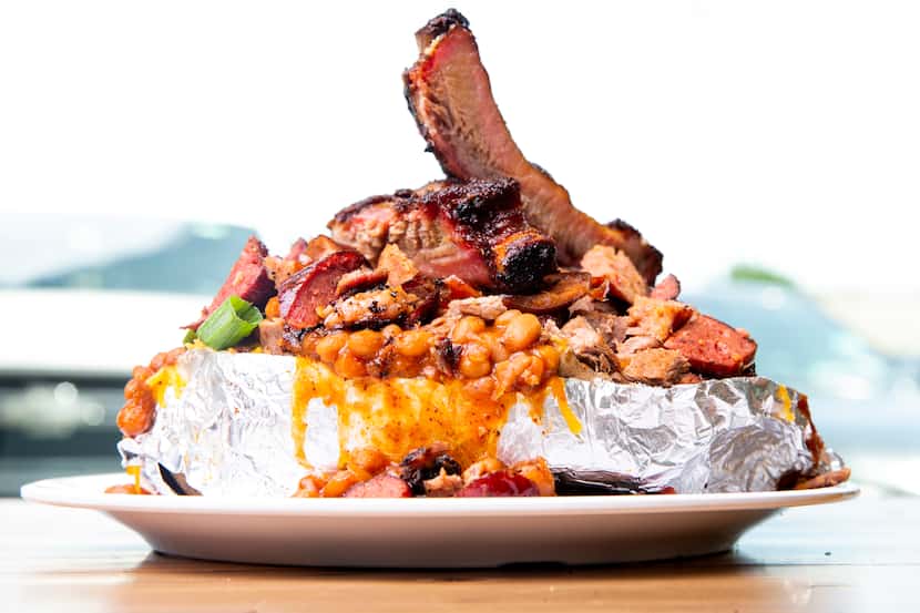 The Food Coma Baked Potato at Smokey John's Bar-B-Que in Dallas is loaded with ribs,...