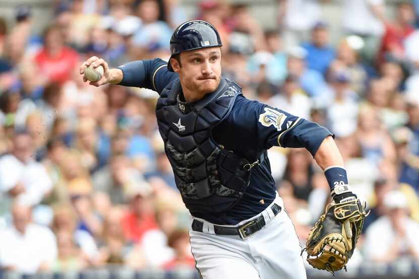 Jun 28, 2015; Milwaukee, WI, USA; Milwaukee Brewers catcher Jonathan Lucroy (20) throws out...