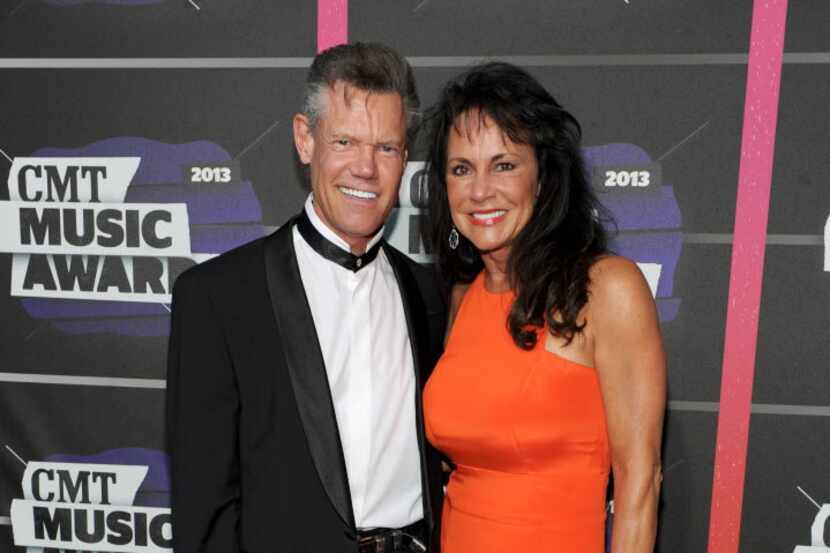 Randy Travis and his now-wife Mary at the CMT Awards in 2013, shortly before he was...