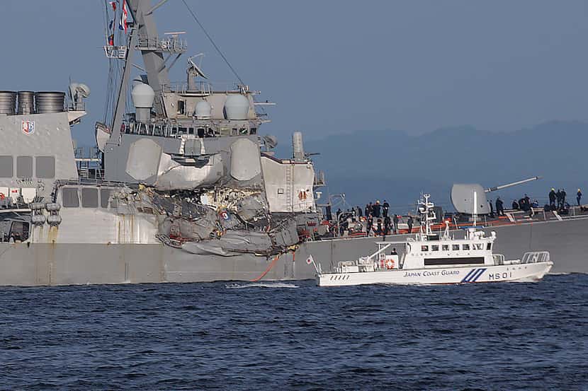 In this Saturday, June 17, 2017, file photo, a Japan Coast Guard ship, foreground, navigates...