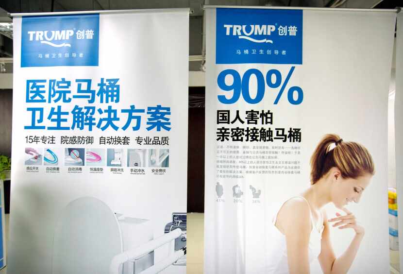 Banners advertising the high-end Trump-branded toilets made by Shenzhen Trump Industrial are...